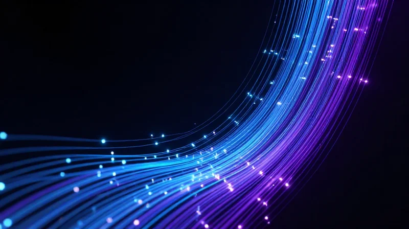 The Evolution of AI Fabrics: Why 800G Matters Abstract visualization of a high-density AI network fabric with glowing fiber optic connections.