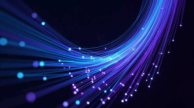 The Evolution of 200G: Why QSFP56 ER4 Matters Abstract representation of high-speed optical data transmission with glowing fiber optic streams extending into the distance.