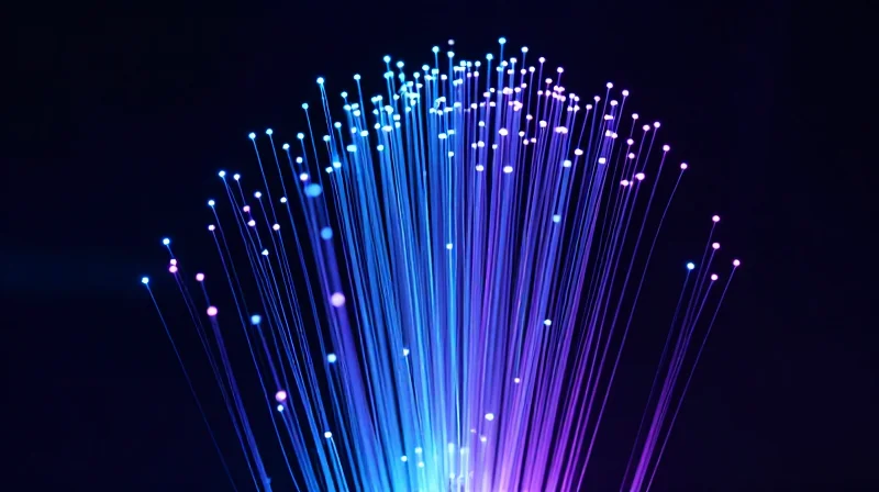 Abstract digital data visualization showing high-speed network connectivity and fiber optic streams.