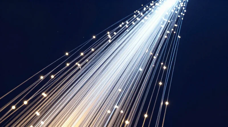 Abstract visualization of light particles and fiber optic streams representing ultra-fast 400G data transmission.
