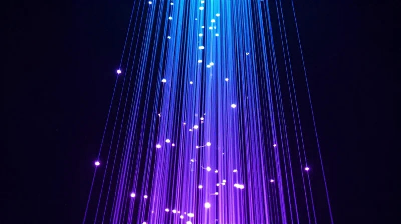 The Growing Bandwidth Crisis in Modern Campus Environments Abstract data visualization showing high-speed fiber optic data streams with glowing light trails in a dark digital space.