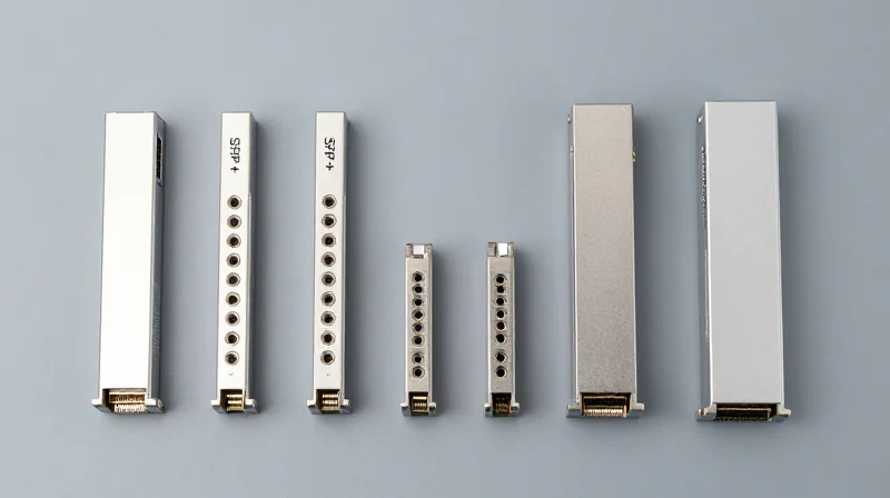 Navigating Juniper Optics Compatibility: SFP+ to QSFP28 Organized flat lay of various optical transceiver modules including SFP+ and QSFP28.