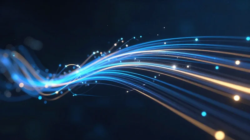 Abstract digital visualization of glowing light streams traveling through fiber optic cables